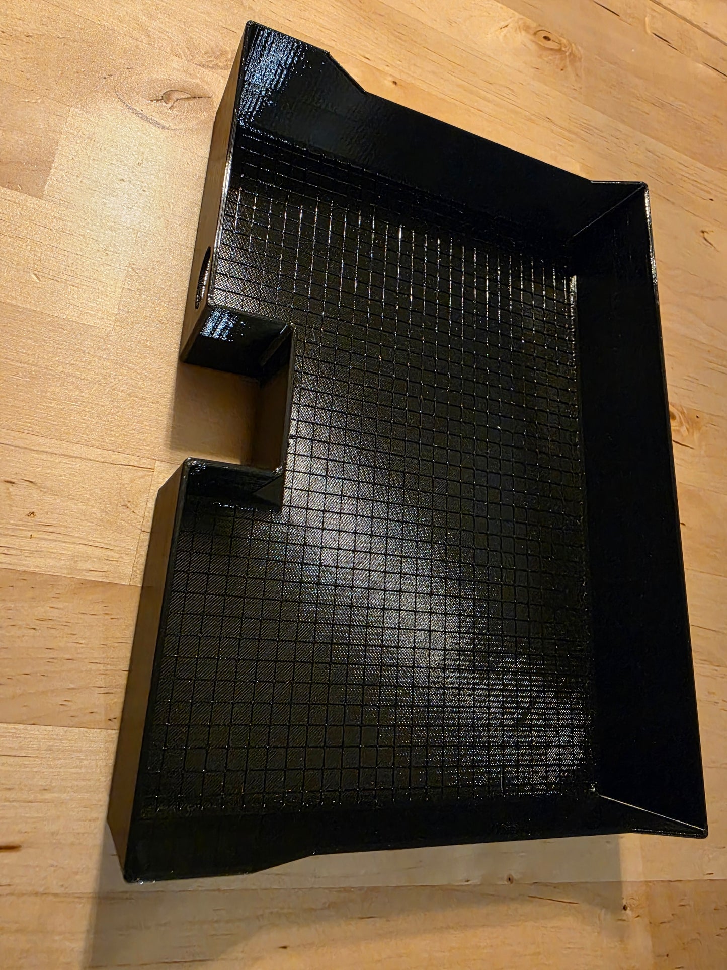 Under seat glovebox tray with flat bottom.